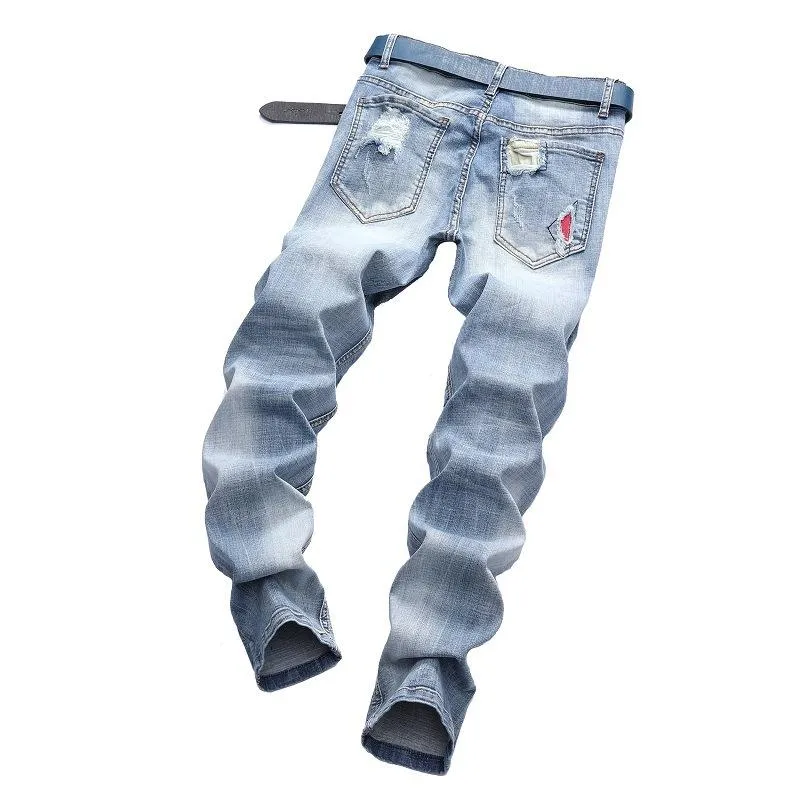 Light-colored stretch biker pants ripped stitching jeans