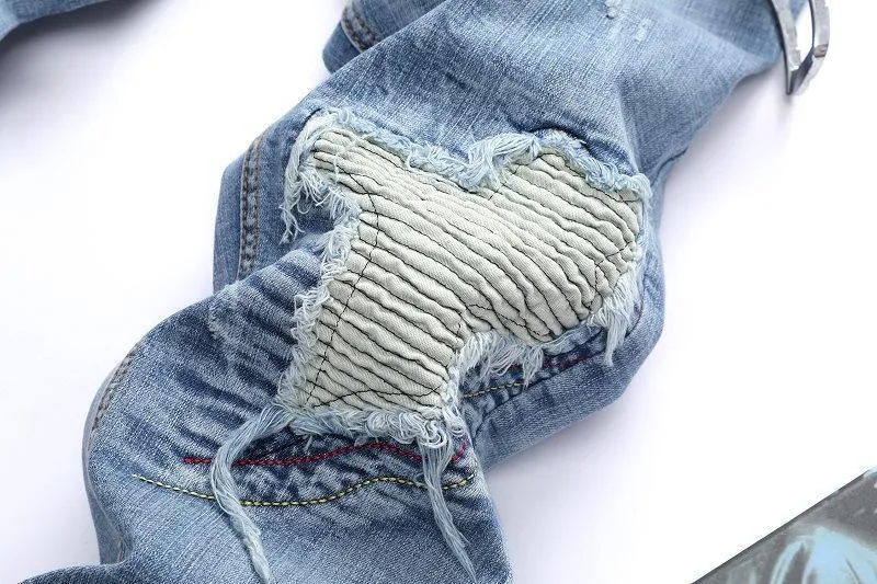 Light-colored stretch biker pants ripped stitching jeans